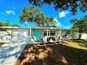 Single-story home features a freshly painted exterior and a bright, inviting front yard at 2141 Holiday Dr, Holiday, FL 34691