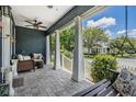 Inviting front porch with cozy seating and charming porch swing at 3450 Ferrell St, New Port Richey, FL 34655