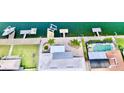 Aerial view of waterway backyard with pool, dock and lift at 5339 Bowline Bnd, New Port Richey, FL 34652
