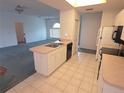 Bright eat-in kitchen overlooks the living room, blending convenience with style at 5373 Frost Rd, Spring Hill, FL 34606