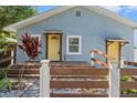 Attractive light blue home with prominent address number and a decorative front garden at 5724 Casson Ave, New Port Richey, FL 34652