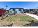 Charming home with a well-maintained lawn, mature landscaping and convenient carport space at 5824 Portsmouth Dr, Tampa, FL 33615