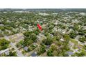 Aerial view of the property and neighborhood featuring mature trees and well-maintained homes at 6019 Wyoming Ave, New Port Richey, FL 34653