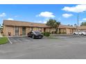 Lovely condos with well-kept lawns, mature trees, and ample parking spaces at 7122 Barclay Ave # B, Spring Hill, FL 34609