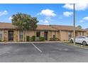 Attractive condo with stone accents, mature trees, and convenient parking space at 7122 Barclay Ave # B, Spring Hill, FL 34609