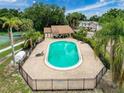 Community pool with ample lounge seating and a covered pavilion offers a refreshing escape at 7133 Trenton Pl, New Port Richey, FL 34653