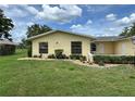 This attractive home features a well-maintained lawn and mature landscaping at 12104 Boynton Ln, New Port Richey, FL 34654