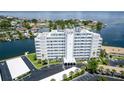 An aerial view of the exterior of the condo community surrounded by manicured landscaping and water at 1365 Snell Isle Ne Blvd # 1B, St Petersburg, FL 33704