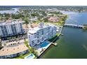 An aerial view of a condominium community and complex, featuring a pool and waterfront access at 1365 Snell Isle Ne Blvd # 1B, St Petersburg, FL 33704