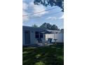 Outdoor patio with table and chairs, perfect for relaxation and entertaining in the privacy of the backyard at 2870 26Th N Ave, St Petersburg, FL 33713