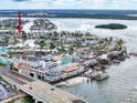 Aerial view of waterfront community near a bridge, offering easy access to nearby amenities at 336 Boca Ciega Dr, Madeira Beach, FL 33708