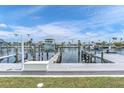 Private boat lift and dock with waterfront access in a canal community at 3701 Corsair Ct, New Port Richey, FL 34652