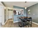 Open dining area with view to the kitchen, tiled floors, and modern decor at 3745 Teeside Dr # 3745, New Port Richey, FL 34655