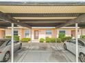 Charming single story home exterior with covered parking, manicured bushes, and neutral paint at 3745 Teeside Dr # 3745, New Port Richey, FL 34655