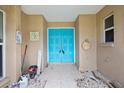 Inviting entryway featuring double blue doors and decorative accents at 4543 Dewey Dr, New Port Richey, FL 34652