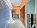 Renovation project with orange walls and exposed framework, tiled floor at 4543 Dewey Dr, New Port Richey, FL 34652