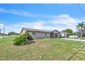 Cozy single-story residence with a one-car garage and easy-to-maintain yard on a corner lot at 5543 Moog Rd, New Port Richey, FL 34652