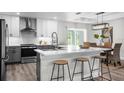Bright kitchen with a large island, stainless steel appliances, and a view to the dining area at 5555 Baffin Cir, Spring Hill, FL 34606