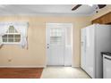 Bright kitchen area featuring tile floors, lots of natural light and modern appliances at 6702 Dartmoor Ln # 7A, New Port Richey, FL 34653