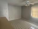 Bright dining room with neutral walls, tile flooring, and a ceiling fan at 7338 Foxbloom Dr, Port Richey, FL 34668