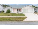 Charming single-story home with well-maintained lawn and a combination brick and painted facade at 9433 Stonewall Ln, New Port Richey, FL 34655