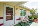 Covered front porch with rocking chairs and a view of the neighborhood at 10600 Oleander Dr, Port Richey, FL 34668