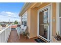 Inviting covered front porch with chairs and views of the neighborhood at 13027 Beacon Ct, Hudson, FL 34667