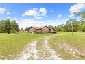 Single story home featuring stone accents, an attached garage and nice landscaping at 13180 Montour St, Brooksville, FL 34613