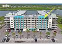 Stunning view of the waterfront condo with ample parking and beautiful landscaping at 19531 Gulf Blvd # 611, Indian Shores, FL 33785