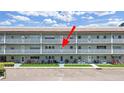 Apartment building exterior view showcasing the front doors, patios, and landscaping of multiple units at 2261 Swedish Dr # 37, Clearwater, FL 33763