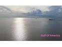 Scenic waterfront view of the calm Gulf of Mexico, perfect for relaxing and enjoying the sunset at 3336 Gulfview Dr, Hernando Beach, FL 34607
