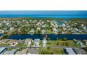 Waterfront community featuring charming houses along canal, offering stunning coastal living with easy access to the ocean at 3363 Poinsettia Dr, Hernando Beach, FL 34607