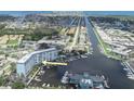 Aerial view of a waterfront condo with marina, close to Gulf Harbor Private Beach, offering desirable coastal living at 4939 Floramar Ter # 203, New Port Richey, FL 34652