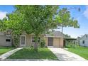 Charming single-story home with well-maintained lawn, covered parking, and mature landscaping at 6030 17Th St, Zephyrhills, FL 33542