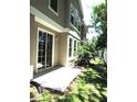 Backyard featuring a concrete patio, lush lawn and white fence at 7650 Red Mill Cir, New Port Richey, FL 34653