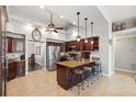 Spacious kitchen with granite countertops, a center island with seating, and stainless steel appliances at 1478 Brigadier Dr, Spring Hill, FL 34608