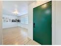 Open entryway showcasing bright living room with wood floors and modern decor at 1652 Larkin Rd, Spring Hill, FL 34608