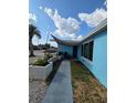 Inviting entrance with a walkway and a covered front porch area at 3252 Columbus Dr, Holiday, FL 34691