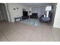 Inviting living room featuring modern furniture, decorative accents, and a stylish area rug at 3252 Columbus Dr, Holiday, FL 34691