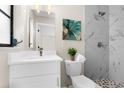 Elegant bathroom featuring shower with marble tile and a modern vanity at 5215 Azalea Cir, Dade City, FL 33523