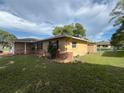 This single story home has a fenced in yard with established landscaping and a well manicured lawn at 10458 Clingman St, Spring Hill, FL 34608