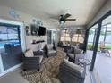 Cozy screened patio with comfortable seating and relaxing ambiance at 3128 Montague Ave, Spring Hill, FL 34608