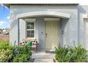 A welcoming front porch with a comfortable bench and decorative pillows, inviting guests to relax and enjoy the outdoor space at 313 Argyll Dr, Spring Hill, FL 34609