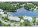 Overhead view of condos with access to a pool and beautiful lake with fountain at 3153 Lake Pine Way # A1, Tarpon Springs, FL 34688