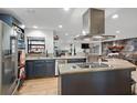 Modern kitchen featuring stainless steel appliances, granite countertops, and an open floor plan at 34955 Blanton Rd, Dade City, FL 33523