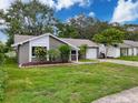 Charming single-story home with well-maintained landscaping and attached one car garage at 3545 Landale Dr, Holiday, FL 34691