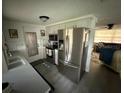 Bright kitchen featuring stainless steel appliances and an open layout to the living room at 5208 Chet Dr, New Port Richey, FL 34652