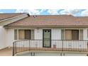 Charming condo exterior with a secure fenced porch area on a sunny day at 6462 River Run Blvd, Weeki Wachee, FL 34607