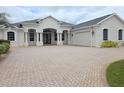 Charming single-story home boasting a spacious driveway and an attached two-car garage at 9188 Mississippi Run, Weeki Wachee, FL 34613