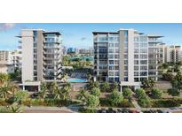 Luxury condo building with pool and waterfront views at 223 Golden Gate Pt # 3A, Sarasota, FL 34236